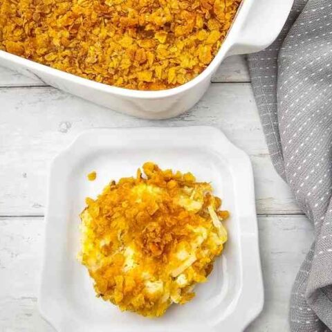 cheesy party potatoes cooked on a plate