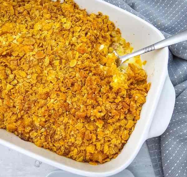 cheesy party potatoes cooked in a dish