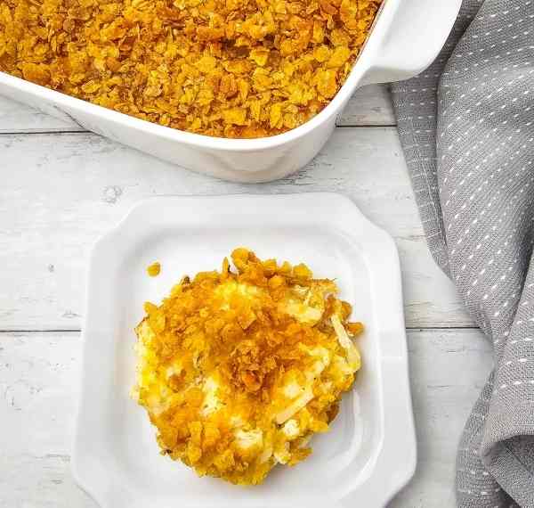 cheesy party potatoes cooked on a plate